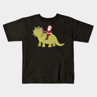 Santa riding a dinosaur Kids T-Shirt